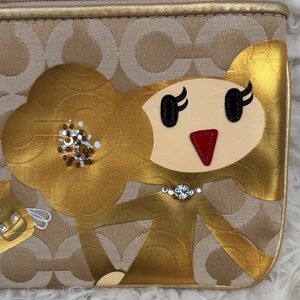 Coach Goldy Signature Canvas Pouch Wristlet with Playful Character